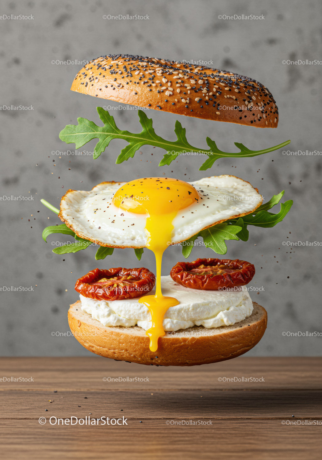 Deconstructed bagel sandwich with egg and arugula