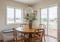 Minimalist dining area with natural wood and greenery