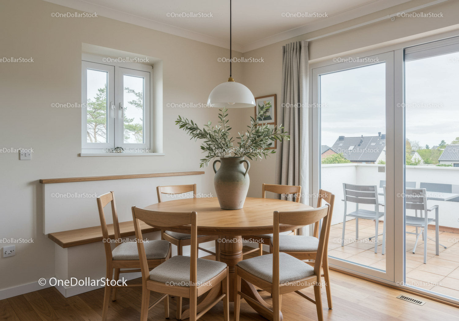 Natural dining space with wooden furniture and greenery