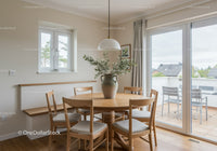 Natural dining space with wooden furniture and greenery