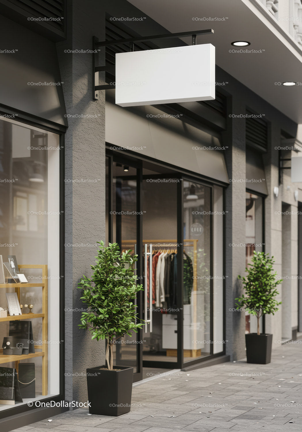 Modern storefront with blank hanging sign and greenery