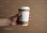 Hand Holding Disposable Coffee Cup with White Sleeve