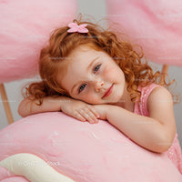 Peaceful Redhead Girl Leaning on Soft Pink Toy