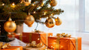 Christmas tree with golden ornaments and wrapped gifts