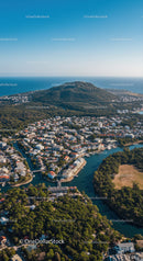 Scenic Coastal Landscape with Mountain, Ocean and Residential Area