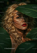 Glamorous Woman with Curly Blonde Hair Among Tropical Leaves
