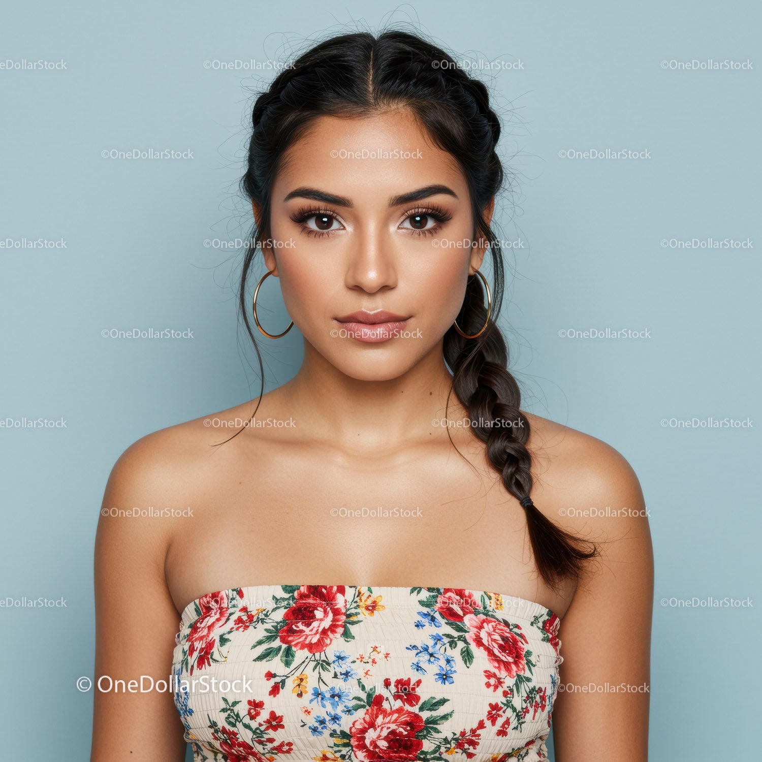 Portrait of a Young Woman with Braid Hairstyle Wearing Floral Top