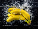 Fresh Ripe Bananas Splashing in Water with Vibrant Color