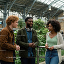 Diverse Friends Engaging in Lively Conversation in Modern Space