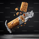 Nutty cereal energy bar breaking apart in foil wrapper