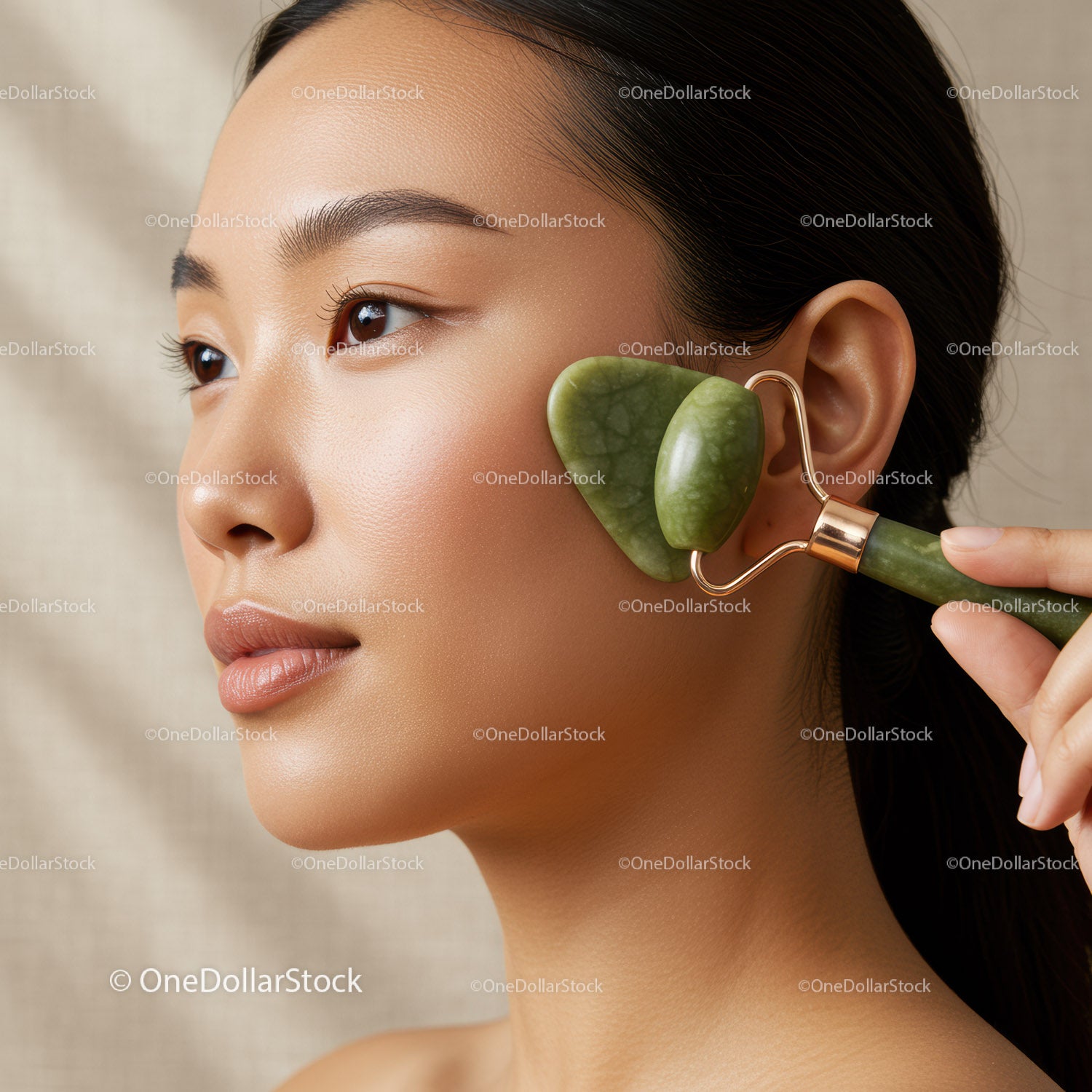 Woman Receiving Facial Massage with Jade Roller for Skin Rejuvenation