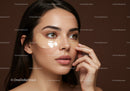 Young Woman Applying under Eye Concealer in Skincare Routine