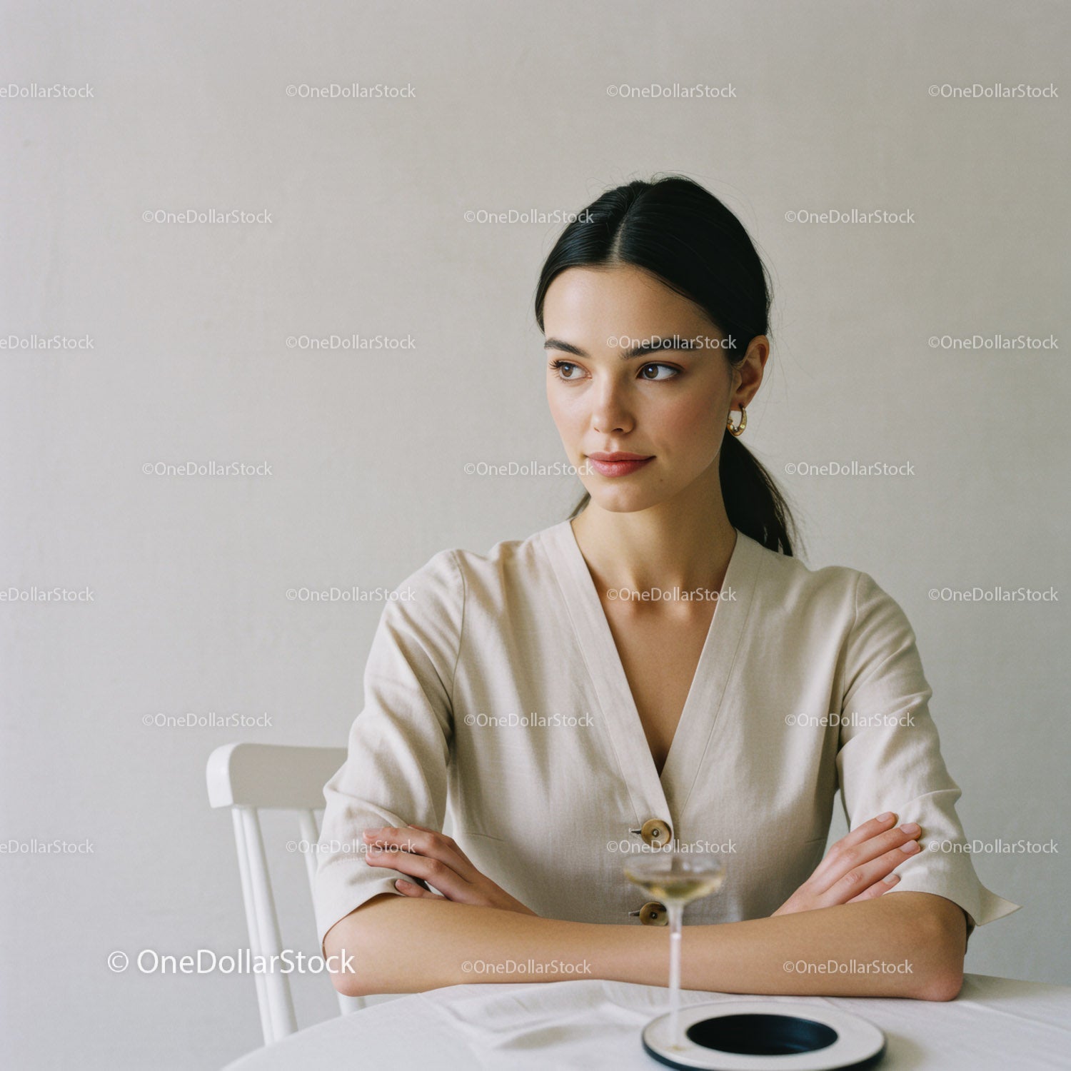 Elegant Woman Portrait with Black Hair and White Dress in Minimalist Setting
