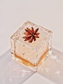 Star anise encased in a clear ice cube