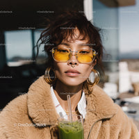 Young Woman with Yellow Sunglasses and Accessories in Stylish Summer Look