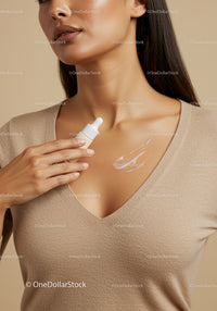 Close-Up of a Woman Applying Skincare Moisturizer on Chest