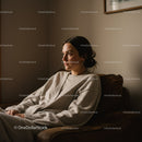 Serene Woman Relaxing on Couch in Cozy Home Setting