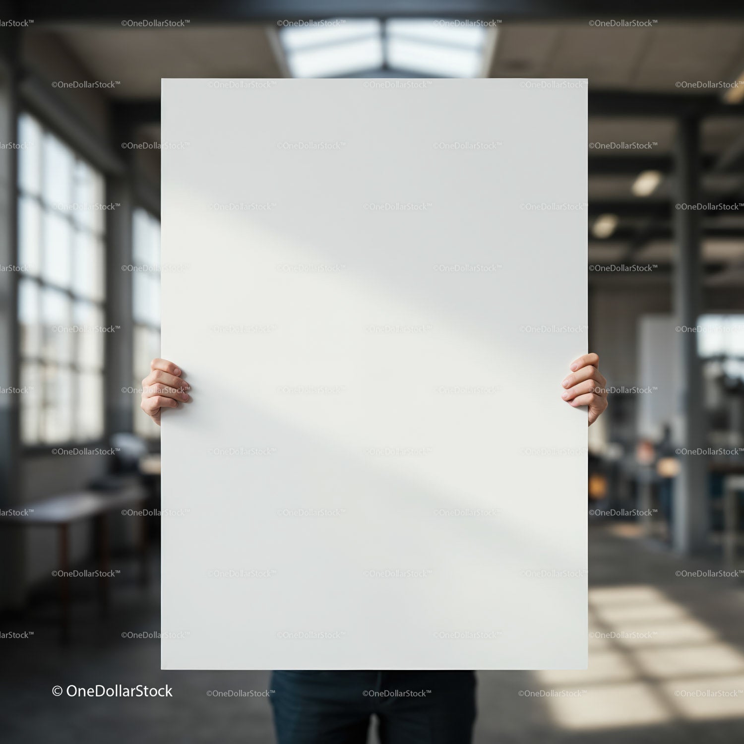 Person Holding Blank White Board in Modern Workspace