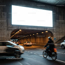 Evening traffic flow under urban concrete overpass