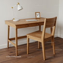 Modern Wooden Desk with Chair and Minimalist Decor in Home Office