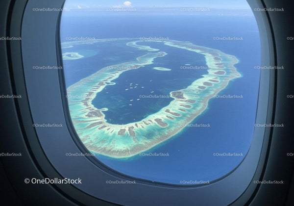 Tropical Island Chain with Turquoise Lagoon and Coral Reefs from Aerial View