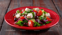 Fresh Vegetable Salad with Cherry Tomatoes and Feta on Red Plate