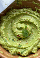Smooth Fresh Guacamole Dip in Rustic Bowl with Spices