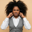 Frustrated Woman Covering Ears with Annoyed Expression