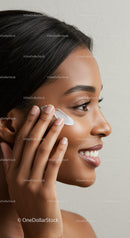 Woman Removing Makeup with Cotton Pad for Clear Skin