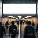 Commuters walking through underground passageway in city