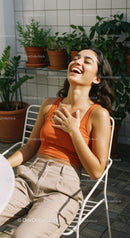 Joyful Woman Relaxing Outdoors on Sunny Summer Day