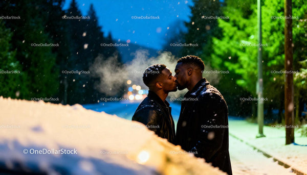 Romantic kiss between couple on snowy winter evening
