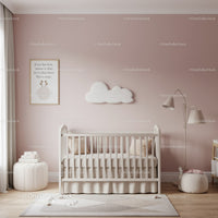 Cozy Baby Nursery with Pink Wall and Cloud Wall Art