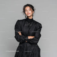 Chic Woman in Elegant Black Dress with Confident Pose