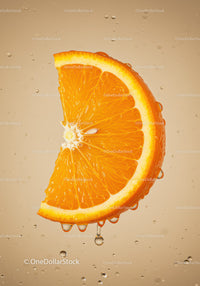 Fresh orange slice dripping with juice in water