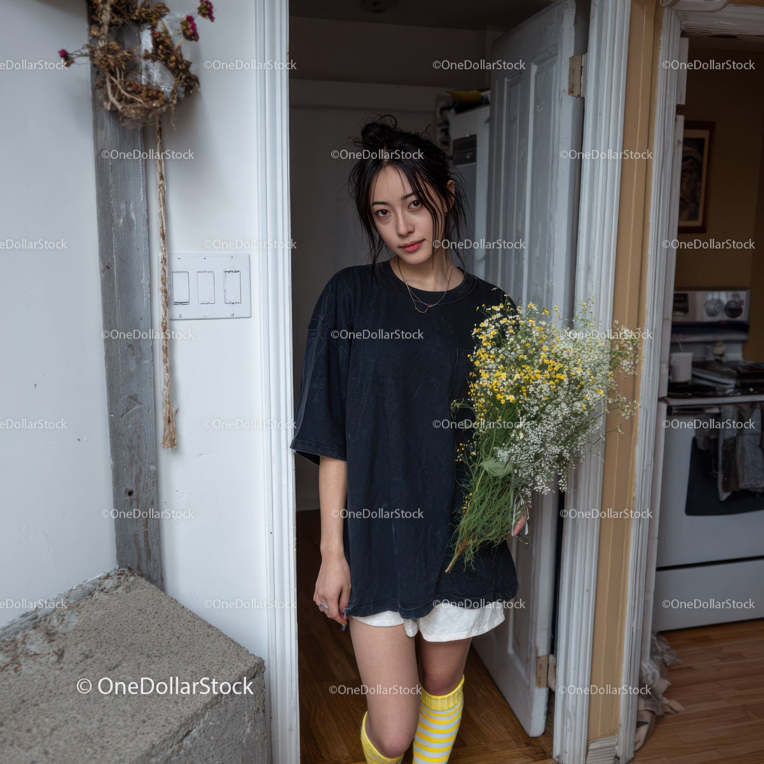 Young Woman with Wildflowers in Casual Indoor Setting
