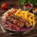 Juicy Steak Kebabs with Golden French Fries and Fresh Vegetables