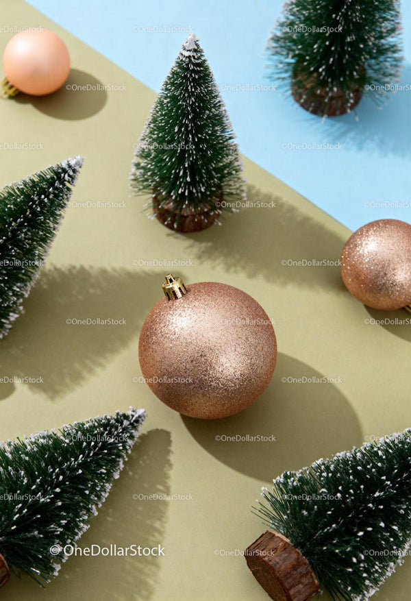 Christmas ornaments and miniature frosted pine trees