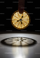 Finger Holding Thin Slice of Lemon with Shadow