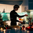 Young man cooking in festive kitchen with Christmas decor