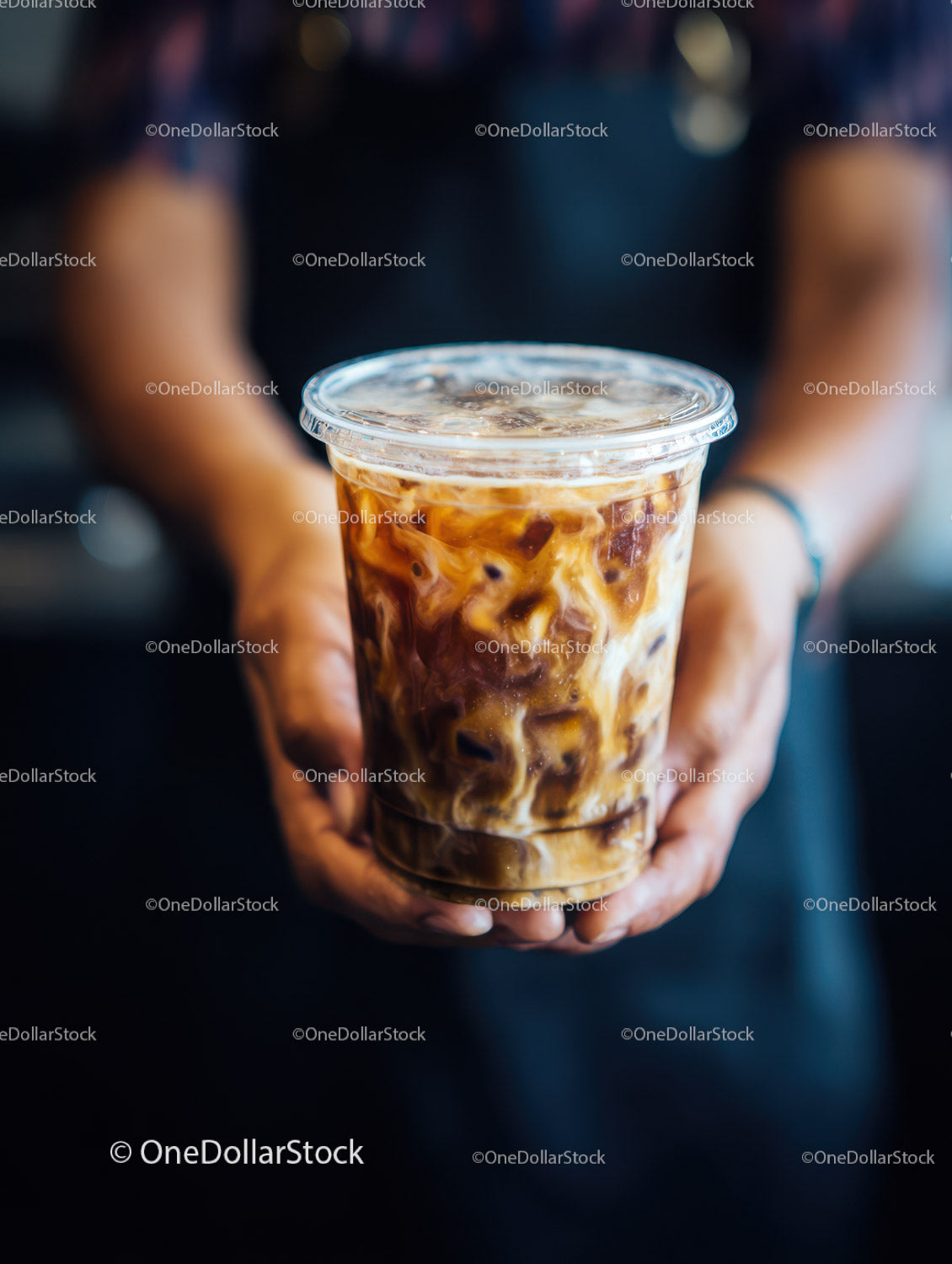 Iced Coffee in Clear Plastic Cup with Ice Cubes and Cream