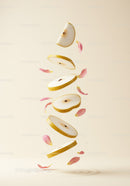Slices of Asian pear suspended with soft pink petals