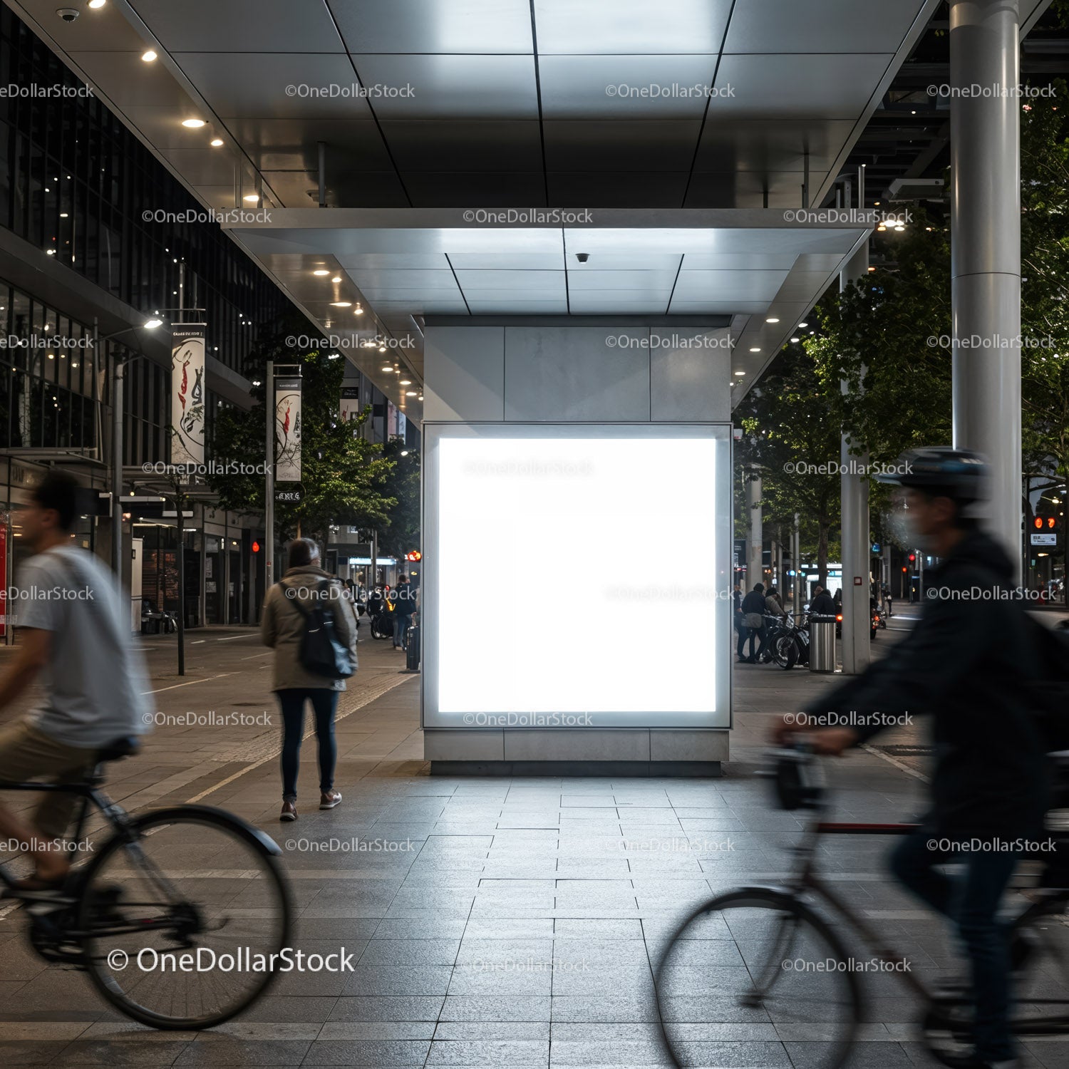 Urban night scene with illuminated blank billboard