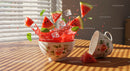 Fresh watermelon splash with mint and ice cubes in bowl