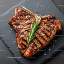 Gourmet Grilled Steak with Rosemary on Black Slate Plate