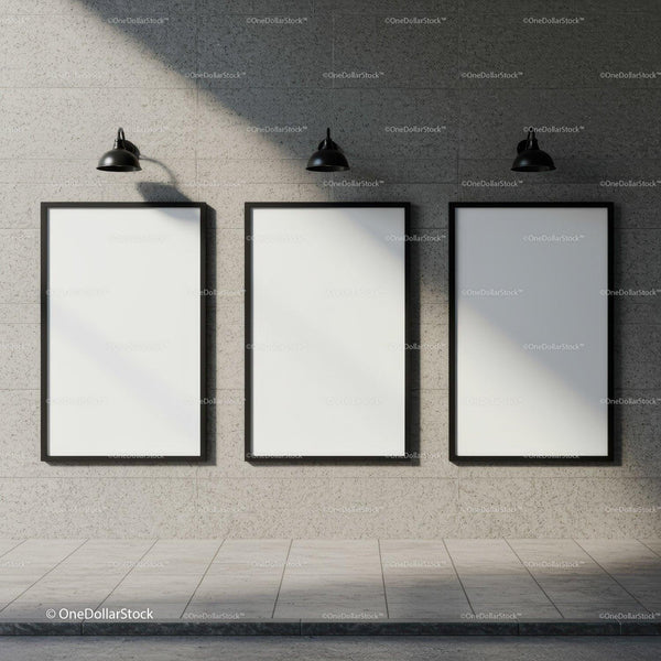 Three blank posters on modern stone wall with lights JPG Mockup Image