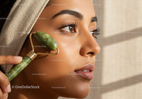 Close-Up of Woman Using Jade Roller for Facial Skin Rejuvenation