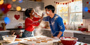 Couple Playfully Baking Heart Cookies in Cozy Kitchen