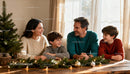 Family enjoying warm holiday moments around decorated table