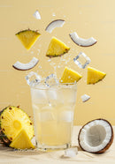 Refreshing Pineapple Coconut Drink with Ice Cubes Splash